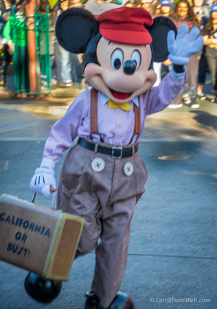 Mickey can be seen in costume, all over the park.  Here a passenger on the Red Trolley.