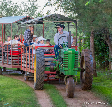Their press release:  A classic John Deere tractor pulls riders in wagons around the Ranch, past vintage farm equipment, farm critters and far into the depths of the Old West where graves are shallow